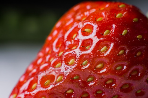 Reife Erdbeeren Makro ein Lebensmittelhintergrund