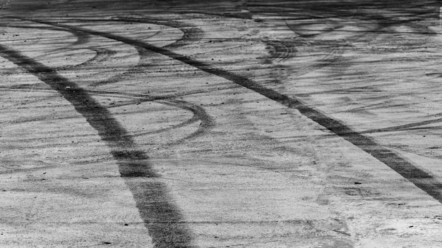 Reifenspuren auf Asphalt-Asphalt-Rennstrecke Textur und Hintergrund Abstract Hintergrund schwarz