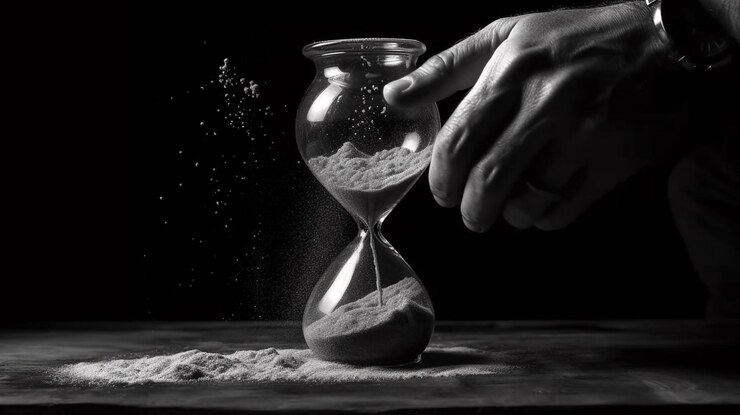 Reloj de arena con arena corriendo a través del vidrio Fotografía en blanco y negro ai generativo