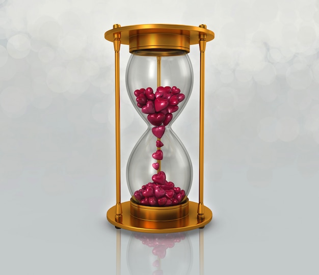 Reloj de arena y corazon rosa.