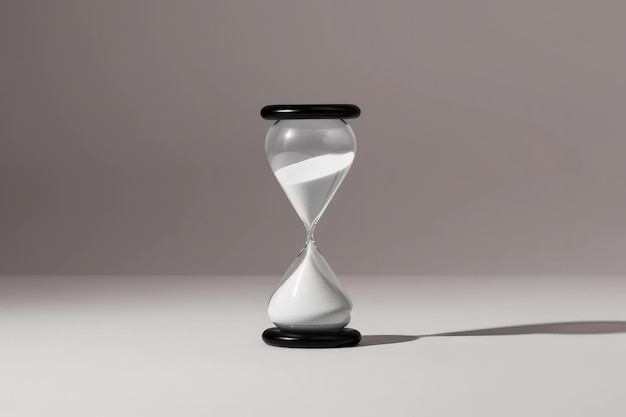 Reloj de arena minimalista en blanco y negro sobre un fondo degradado IA generativa