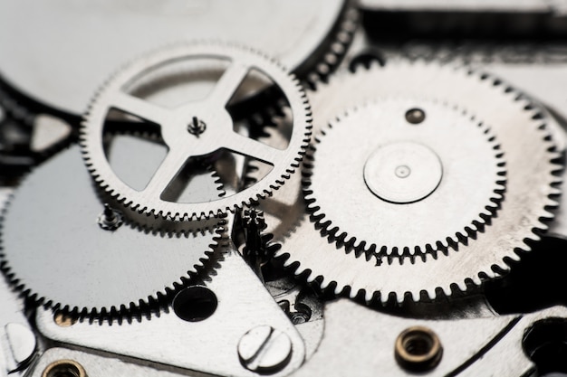 Reloj mecánico / Gear Clock. Cerrar dientes y engranajes dentro del fondo del reloj