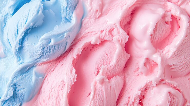 Los remolinos de helado azul y rosa crean una textura deliciosa que evoca una sensación de alegría e indulgencia. Este postre vibrante es perfecto para golosinas de verano y celebraciones.