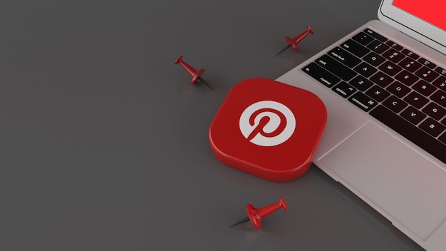 Renderização em 3D de alguns pinos e um emblema quadrado do Pinterest sobre o laptop em fundo cinza