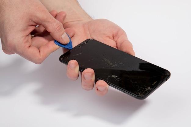 Foto reparación de teléfonos con vidrios rotos de cerca