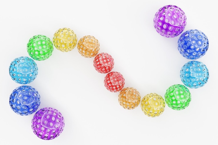 Foto representación 3d bolas multicolores con agujeros en forma de serpiente primer plano de las formas geométricas de la bola sobre un fondo blanco