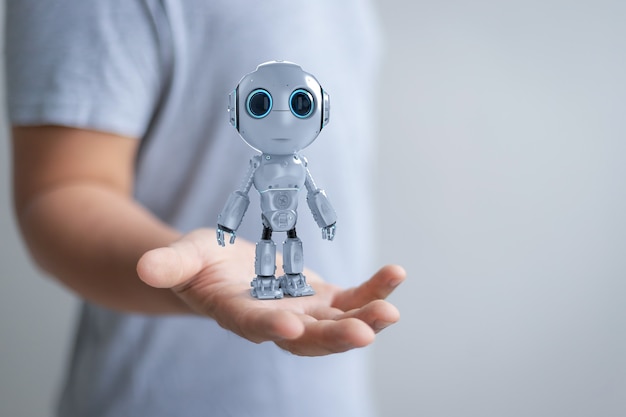 Representación 3D de mini robot en mano humana