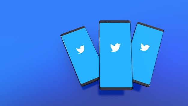 Representación 3D de teléfonos inteligentes con el logo de Twitter en pantalla