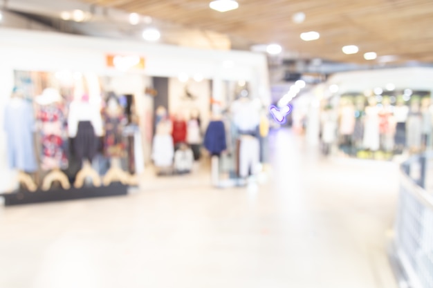 Foto resumen borrosa centro comercial de grandes almacenes con fondo de personas