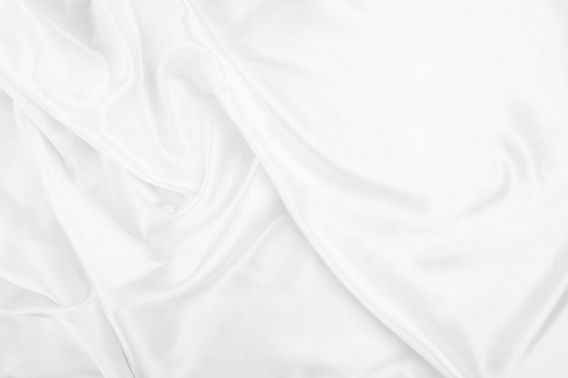 Foto resumen de fondo de tela blanca con ondas suaves, textura de primer plano de tela