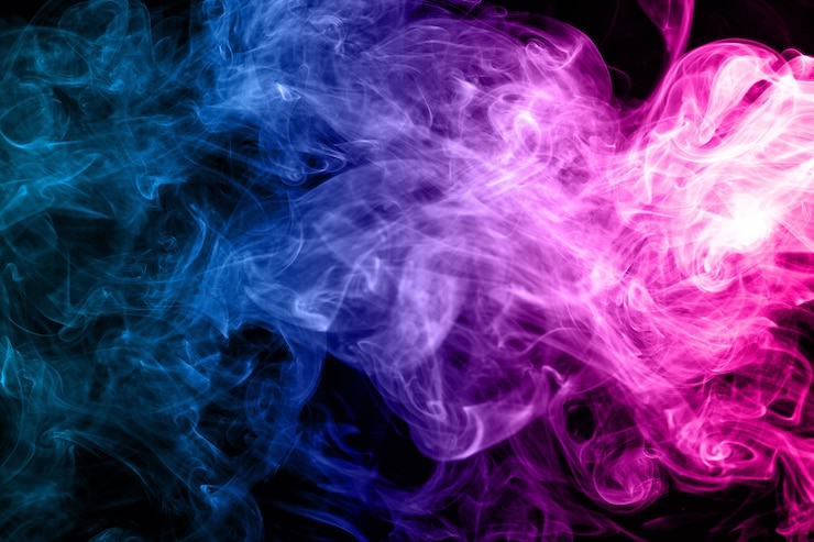 Foto resumen humo azul y rosa sobre un fondo oscuro