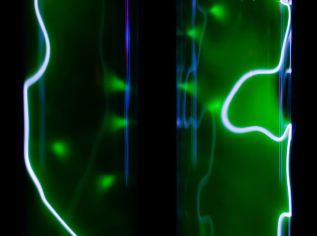 Resumen resplandor verde de fondo fluorescente de gas inerte en frascos de vacío