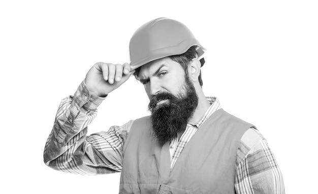 Retrato de un constructor. Trabajador en uniforme de la construcción. Constructores de hombres, industria. Constructor en casco, capataz o reparador en el casco. Trabajador barbudo en la construcción de casco o casco