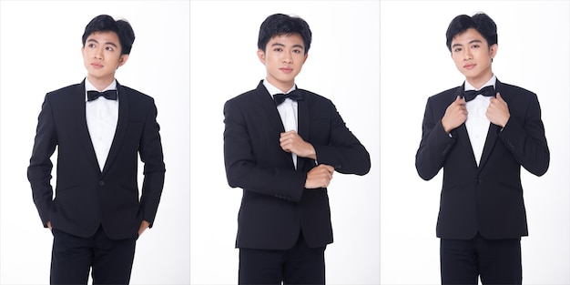Retrato de meio corpo 20s homem de negócios asiáticos usar sapatos pretos Formal Suit calças para o jantar de gala e comemorar a reunião. Jovem macho inteligente fica confiante sentindo sorriso feliz. Fundo branco isolado