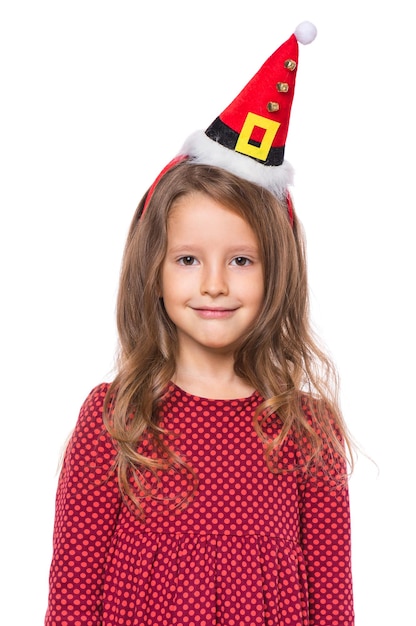 Foto retrato de menina sorridente com chapéu de papai noel conceito de natal feliz criança bonita isolada em fundo branco