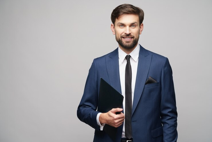 Foto retrato de um homem de negócios jovem bonito segurando pasta