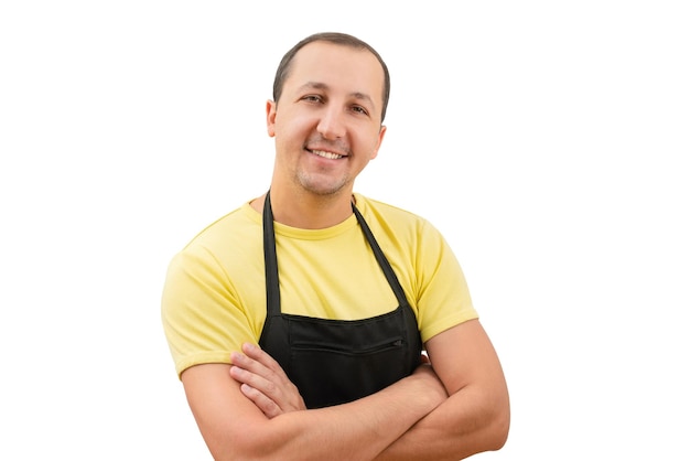 Foto retrato de um homem feliz em um avental olhando para a câmera em um fundo branco isolado