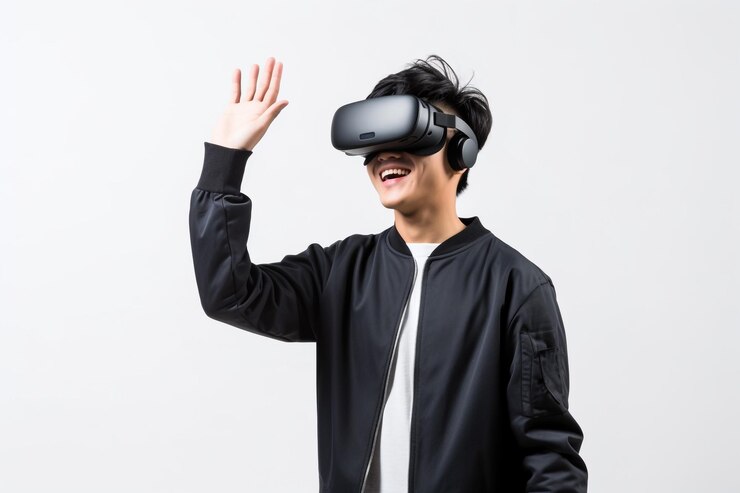 Retrato de estudio hombre con auricular de realidad virtual aislado en fondo gris gafas de realidad virtual Tecnología