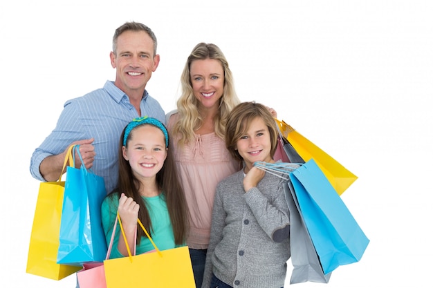 Foto retrato de familia sonriente con bolsa de compras