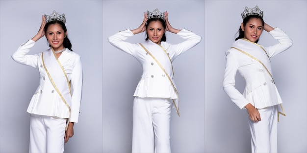 Retrato instantâneo, mulher de negócios asiática transgênero usa calças de terno branco cabelo preto e concurso Miss Beauty Queen coloca a faixa da coroa, iluminação de estúdio fundo cinza isolado grupo de colagem