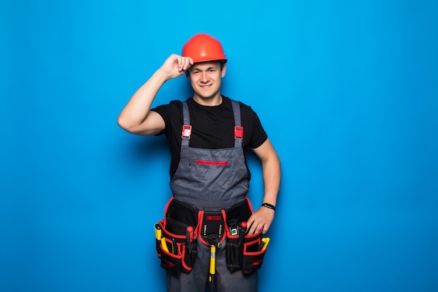 Foto retrato de manitas feliz con cinturón de herramientas y hemlet