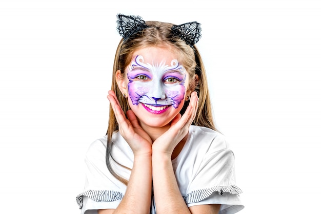 Foto retrato de muchacha adolescente con pintura de cara de gato