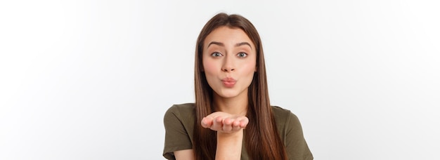 retrato, de, un, mujer joven, soplar, un, beso, aislado, encima, blanco