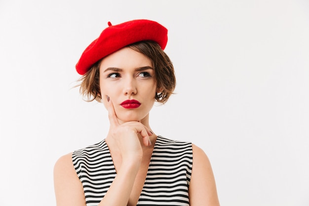 Retrato de una mujer pensativa vestida con boina roja