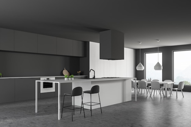 Rincón de cocina moderna con paredes grises, suelo de piedra, encimeras grises, barra blanca con taburetes y mesa blanca larga con sillas. representación 3d
