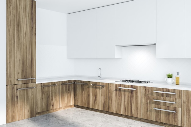 Rincón de cocina con paredes blancas, suelo de hormigón, encimeras de madera con fregadero y cocina empotrados y armarios blancos. representación 3d