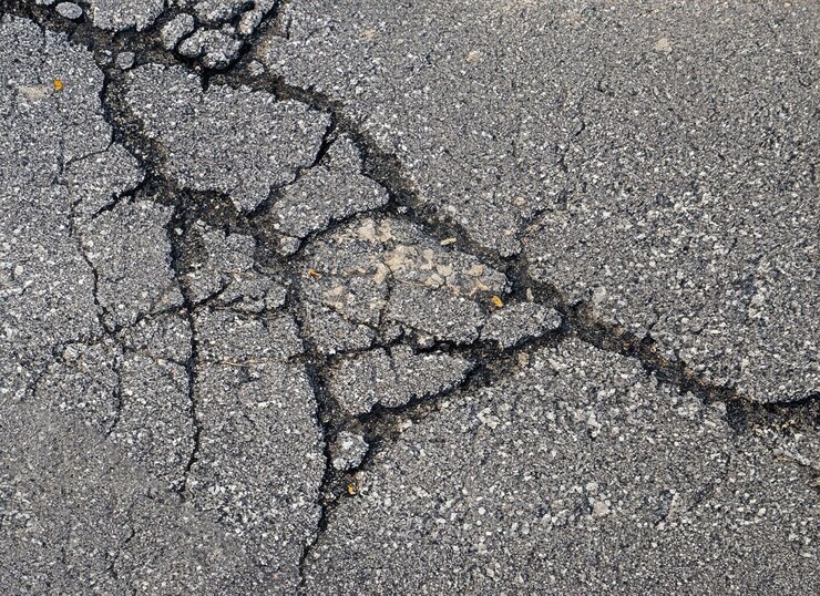 Rissige Asphalt-Textur Hintergrund