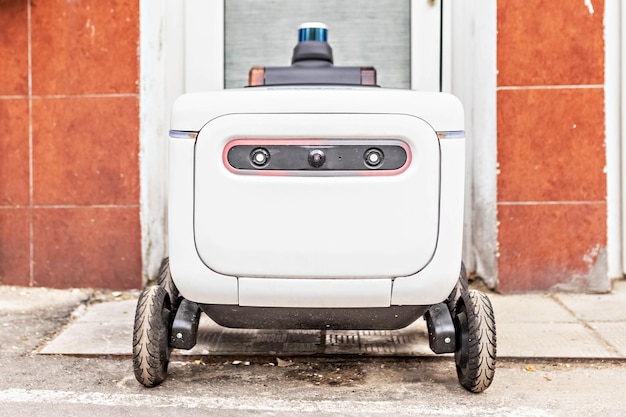 Foto robô de entrega automático para o transporte de mercadorias e pacotesrobô elétrico futurista