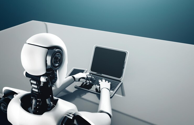 Foto el robot humanoide xai usa una computadora portátil y se sienta en la mesa en la oficina del futuro