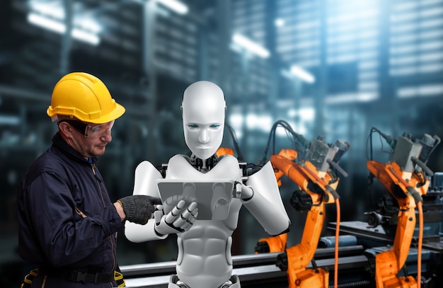 Robot de la industria mecanizada y trabajador humano trabajando juntos en la fábrica del futuro