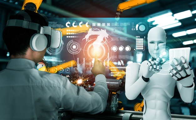 Robot de la industria mecanizada y trabajador humano trabajando juntos en la fábrica del futuro