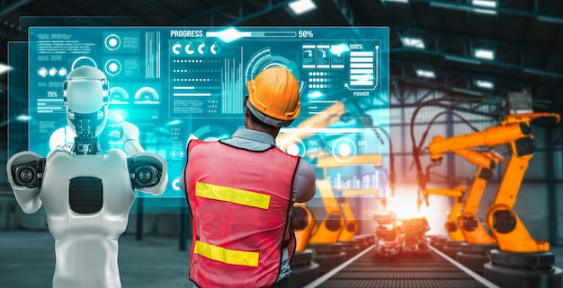 Robot de la industria mecanizada y trabajador humano trabajando juntos en la fábrica del futuro