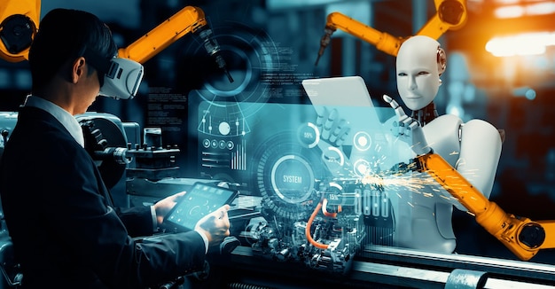 Robot industrial mecanizado y trabajador humano trabajando juntos en la fábrica del futuro