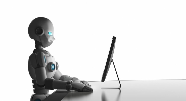 Foto robot usando una computadora contra un fondo blanco
