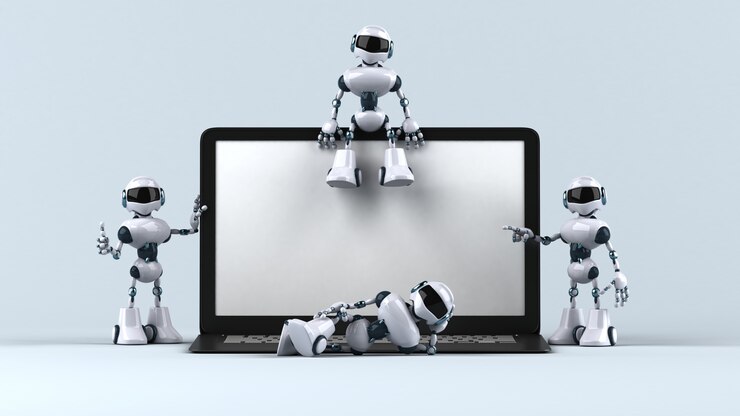 Foto robots divertidos junto a una computadora portátil