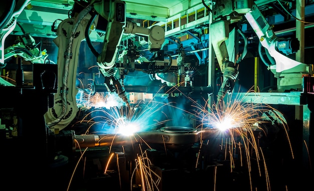 Foto los robots mecánicos están trabajando para reemplazar a las personas en la industria del futuro