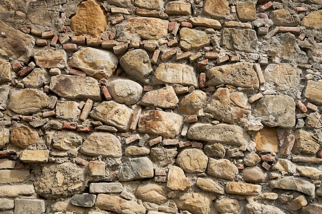 Rock-Stein-Textur. Eine Mauer aus Bergsteinen