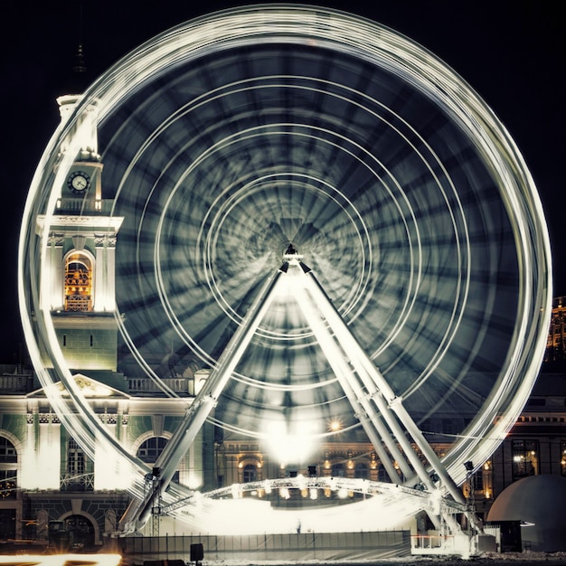 Foto roda da visão na praça kontraktova, kiev. cidade noturna. fechar-se