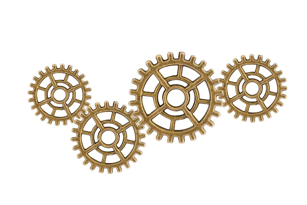 Rodas de engrenagens e engrenagens isoladas em um mecanismo de relógio de fundo branco, motor de metal de latão industrial