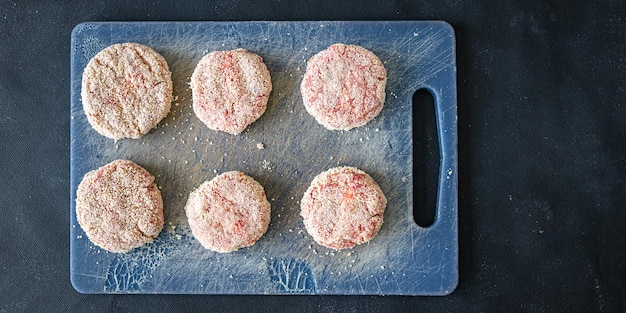 rohes Kotelettfleisch frische Koteletts gesunde Mahlzeit Lebensmittelsnack auf dem Tisch kopieren Raum Lebensmittelhintergrund