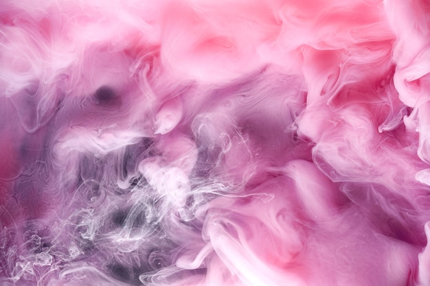 Rosa grauer Rauch auf schwarzem Tintenhintergrund bunter Nebel abstrakte wirbelnde Berührung Ozean Meer Acrylfarbe Pigment unter Wasser