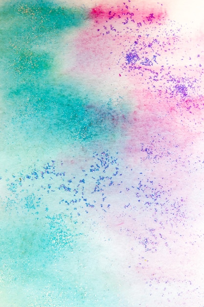 Rosa-grüne Aquarellflecken mit Funkeln. Abstrakter Hintergrund