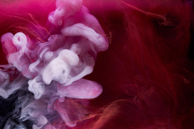 Rosa Rauchtinte Hintergrund bunter Nebel abstrakt wirbelnde Berührung Ozean Meer Acrylfarbe Pigment unter Wasser