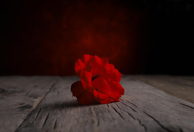 Foto una rosa solitaria en una mesa vintage