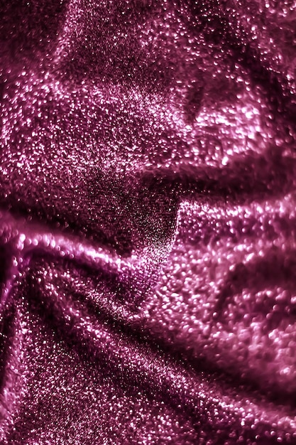 Rosafarbener, funkelnder, glitzernder abstrakter Hintergrund, luxuriöses, glänzendes Stoffmaterial für Glamour-Design und festliche Einladung