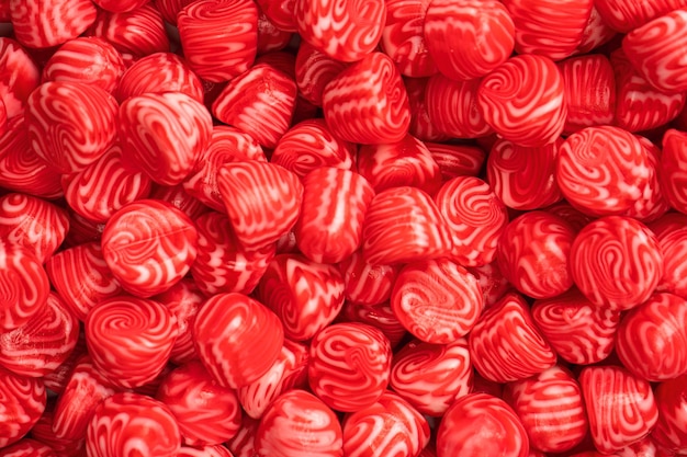 Rote runde leckere Gummibonbons als Hintergrund